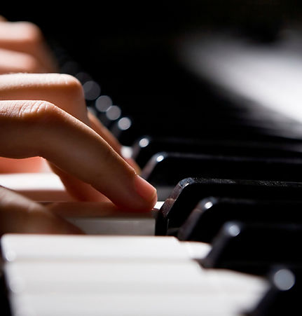 Fingers on piano keys